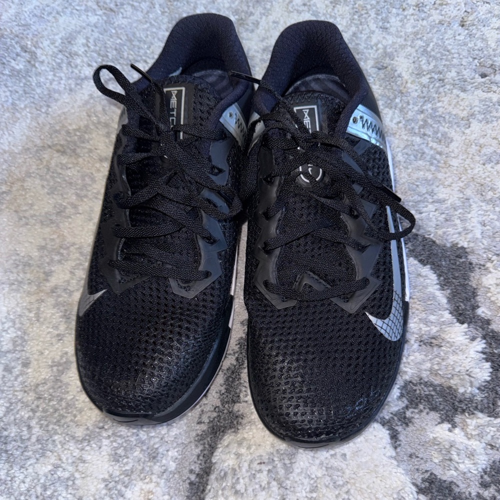 Women’s Nike Metcon black and silver sneakers